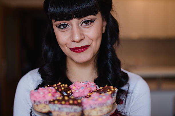 istock Girl with Cupcakes 625913438