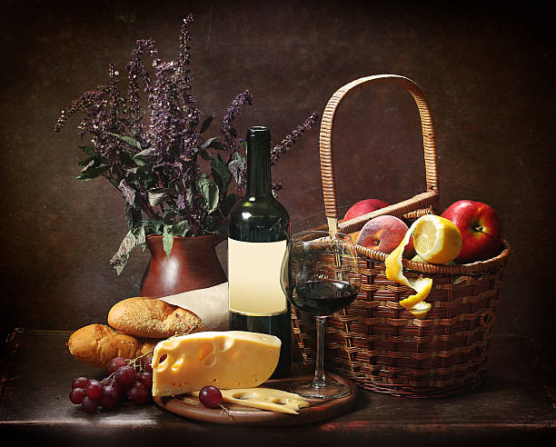 istock Red wine with cheese and grapes near barrel 625913932