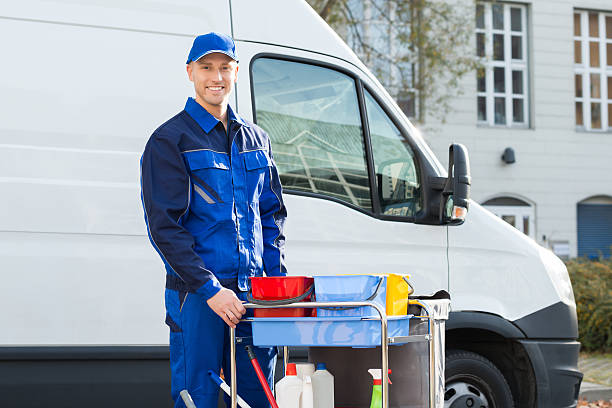 istock Happy Janitor Standing With Cleaning Equipment 625914124