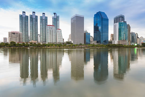 istock Office building with water reflection in public park 625914230