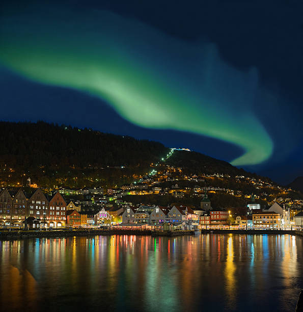 Northern lights - Green Aurora Borealis over Bergen, Norway Shape of green Aurora Borealis over Bergen, Norway. norway aurora borealis aurora polaris fjord stock pictures, royalty-free photos & images