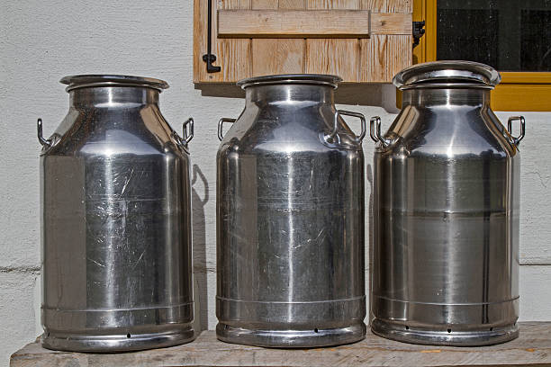 istock Milk cans in front of the mountain hut 625914926