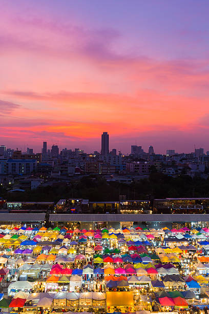 istock Multiple colour city night market with dramatic after sunset sky 625915696