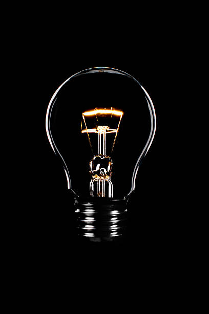 Light bulb Light bulb with black background light bulb filament photos stock pictures, royalty-free photos & images