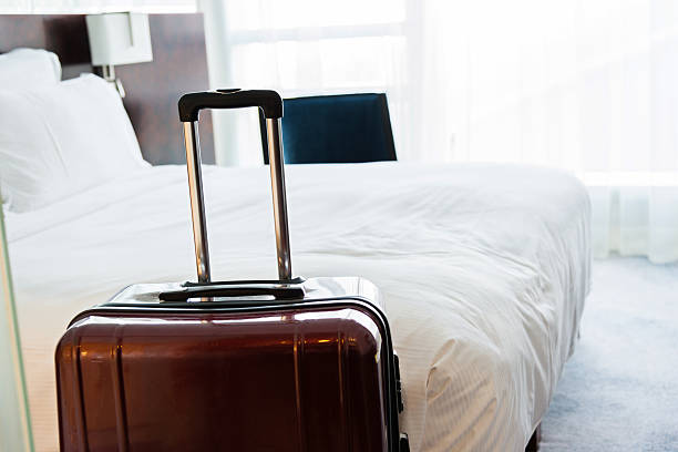istock Suitcase in hotel room 625917488