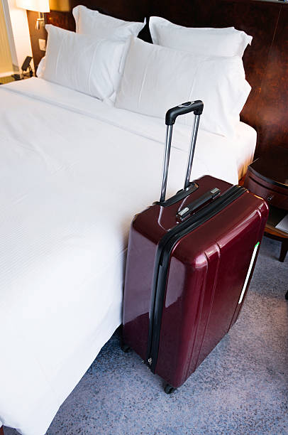 istock Suitcase in hotel room 625917660