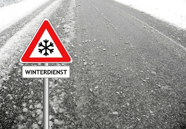 istock snow warning sign winter street 625925512