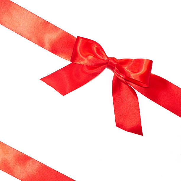 istock Red bow and diagonal ribbons with tails 625927154