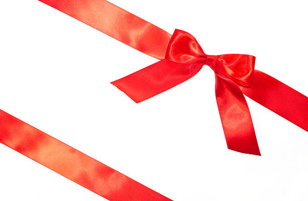 istock Red bow and diagonal ribbons with tails 625927198
