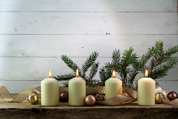 istock white burning candles on the fourth advent, rustic christmas decoration 625927584