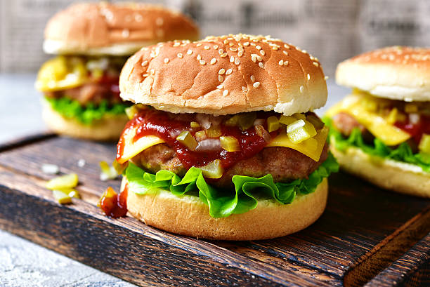 istock Cheeseburger with meat cutlet and pickled vegetable. 625928784