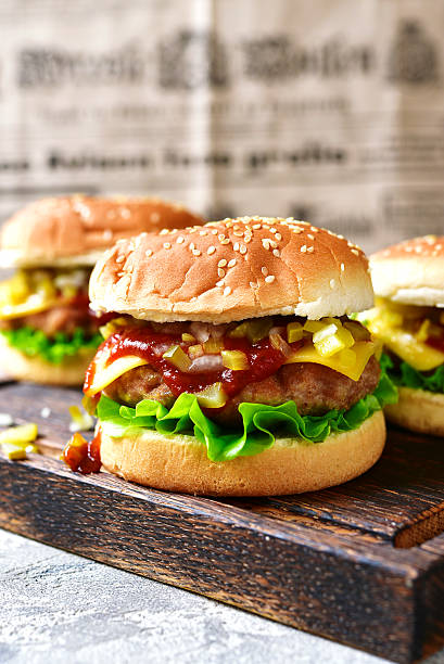 istock Cheeseburger with meat cutlet and pickled vegetable. 625929468