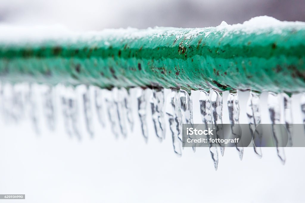 Frozen icy down pipe Frozen icy down pipe, icicles Pipe - Tube Stock Photo