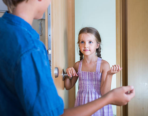 istock child receiving expected friend at home interior 625935286