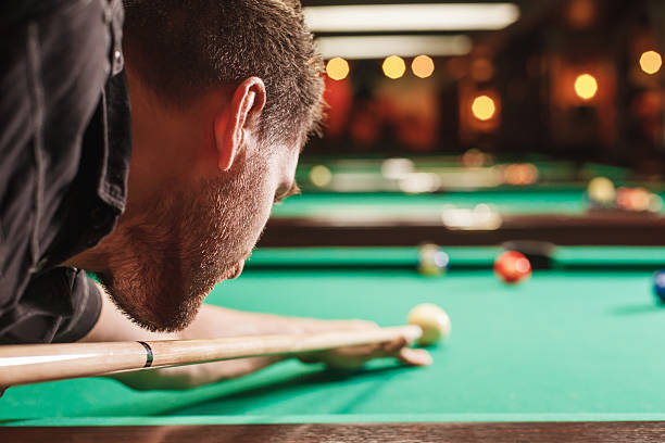 istock Man trying to hit the ball in billiard. 625935486