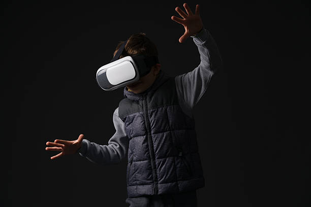 istock Boy is surprised by content on VR glasses 625938502