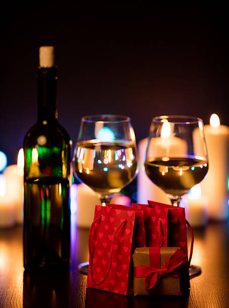 istock Two glasses of wine and gift box 625939018