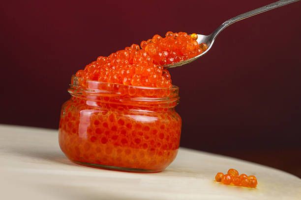 istock red caviar in glass bowl with spoon 625941276