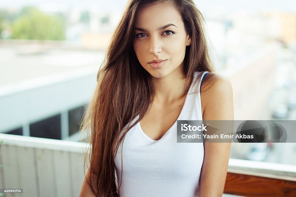 Headshot of a beautiful teenager A beautiful close-up headshot of young pretty woman, Portrait of a teenager in outdoors with natural light. 2016 Stock Photo