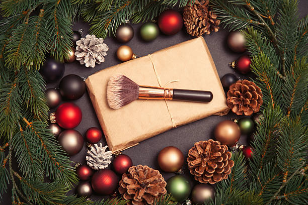 istock Christmas gift and baubles with makeup brush 625942638