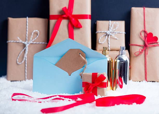 istock Christmas gifts and envelope with perfume 625945094