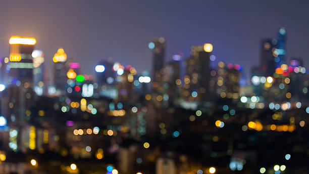 istock Abstract blurred lights city office building downtown background 625945904