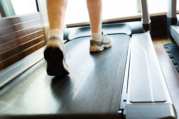 istock Unrecognizable woman walking on treadmills 625954742