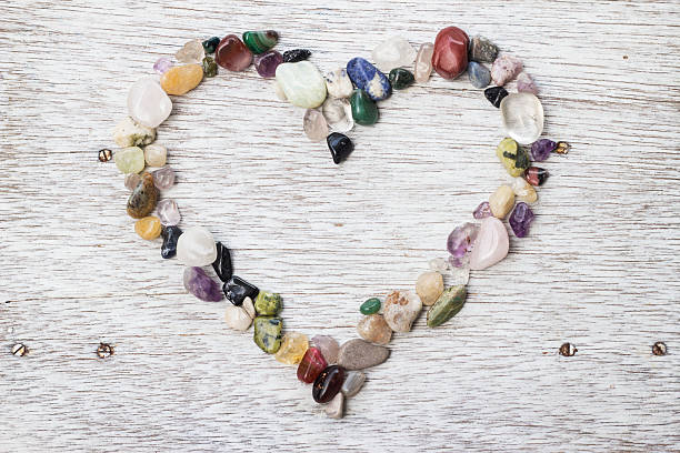 istock Heart shaped frame made of pebbles 625957134