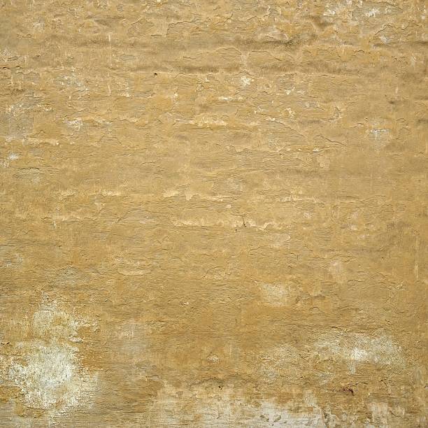 istock Grungy Yellow Cracked  Plaster Old Wall Frame Square Background 625958420