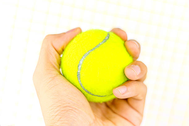 istock beautiful hands holding tennis ball 625959026