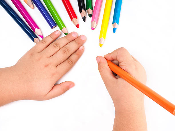 istock Girl draws with colored pencils 625960370