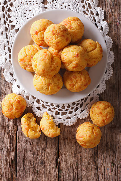 istock Tasty cheese buns gougere close-up on the table. Vertical 625961474