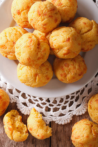 istock Cheese snack buns close-up on a plate. Vertical top view 625961560