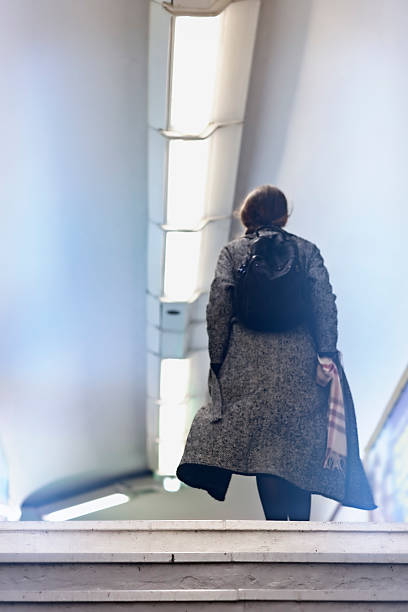 istock French woman walks in Paris metro 625964332