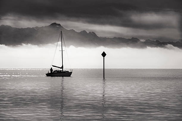istock Monochrome image of a single boat sailing 625972382