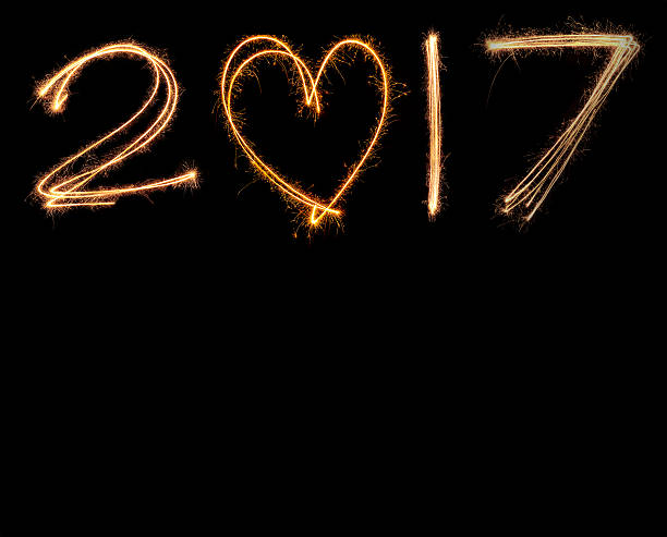istock happy new years 2017 fireworks Sparkle alphabet on black background 625972442