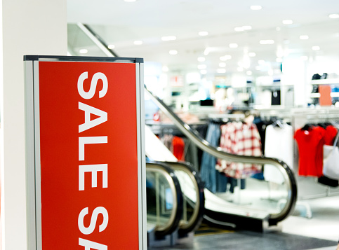 Sale signs in a fashion store.