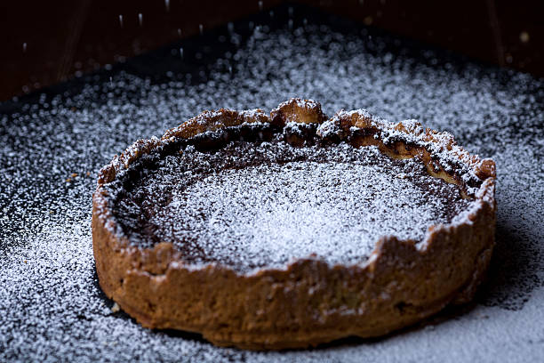 istock Homemade chocolate tart on black background 625977014