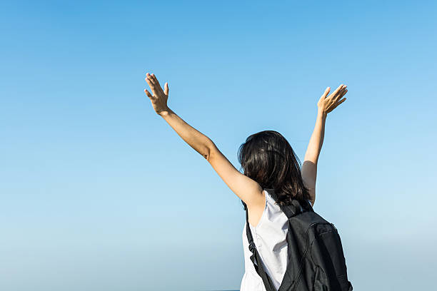 istock pretty asian girl relax with blue sky 625977712