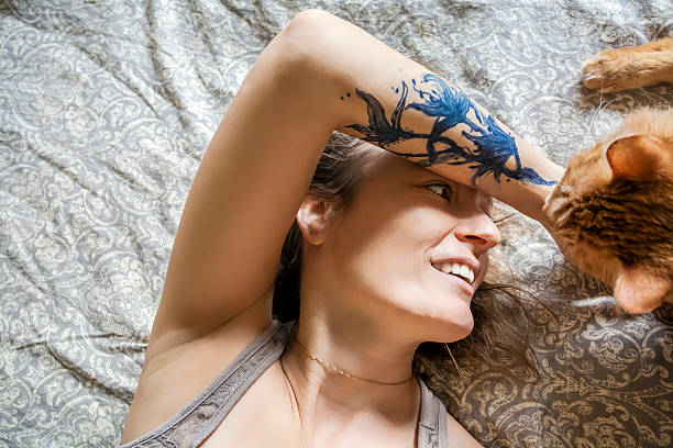 istock Woman in her bed with her beloved cat 625984338