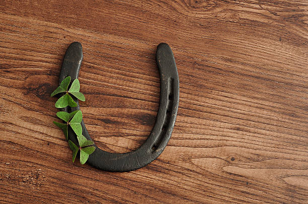 istock Horse shoe displayed with clovers for St. Patrick's day 625984520