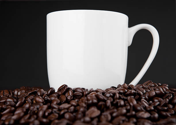 istock Hot coffee cup on beans for breakfast morning 625990660