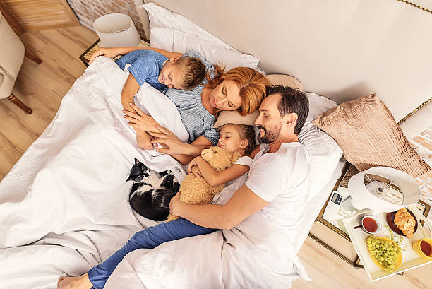 istock Children sleeping with their parents 625996818