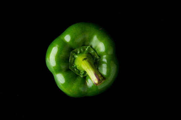 Close up Sweet Pepper on black acrylic.This is low-key photo