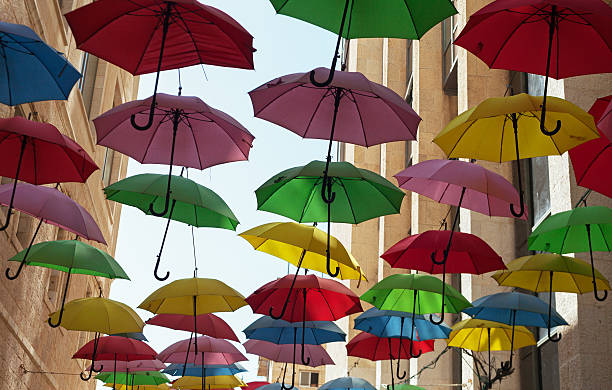 istock Multicolored umbrellas on the street. 626002210