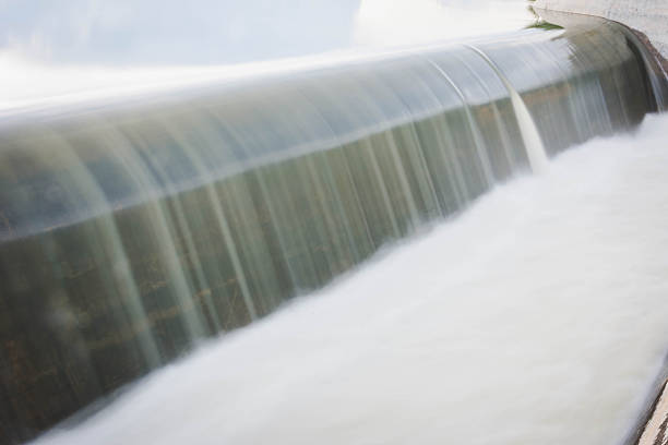 istock motion blur of waterfall from overflow of dam 626003214