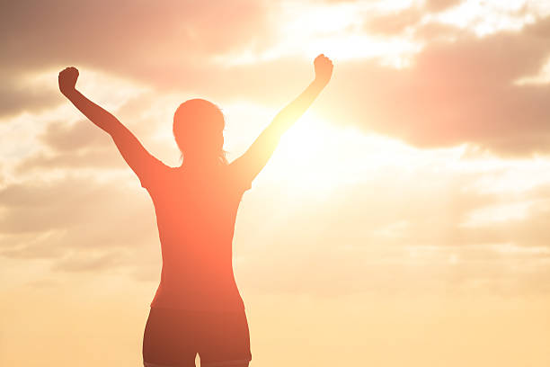 istock silhouette of woman pray 626004090