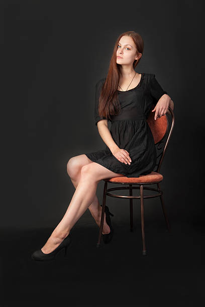 istock woman in a chair 626006576