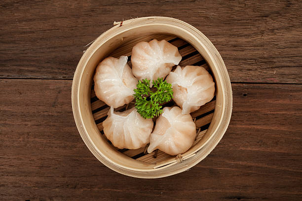 Chinese dumpling in a bamboo steamer box stock photo