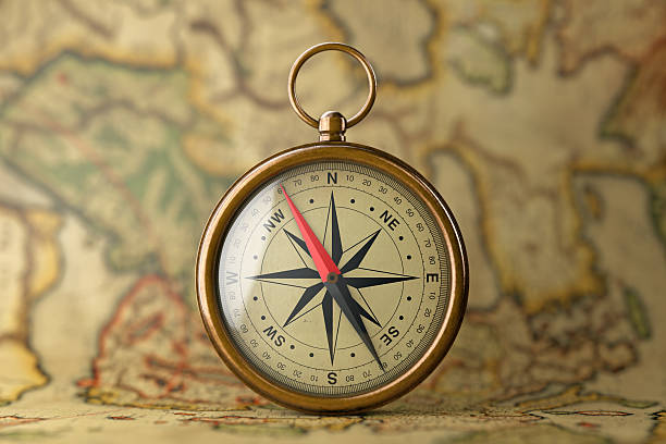 istock Antique Vintage Brass Compass on a Rare Map. 3d Rendering 626008888